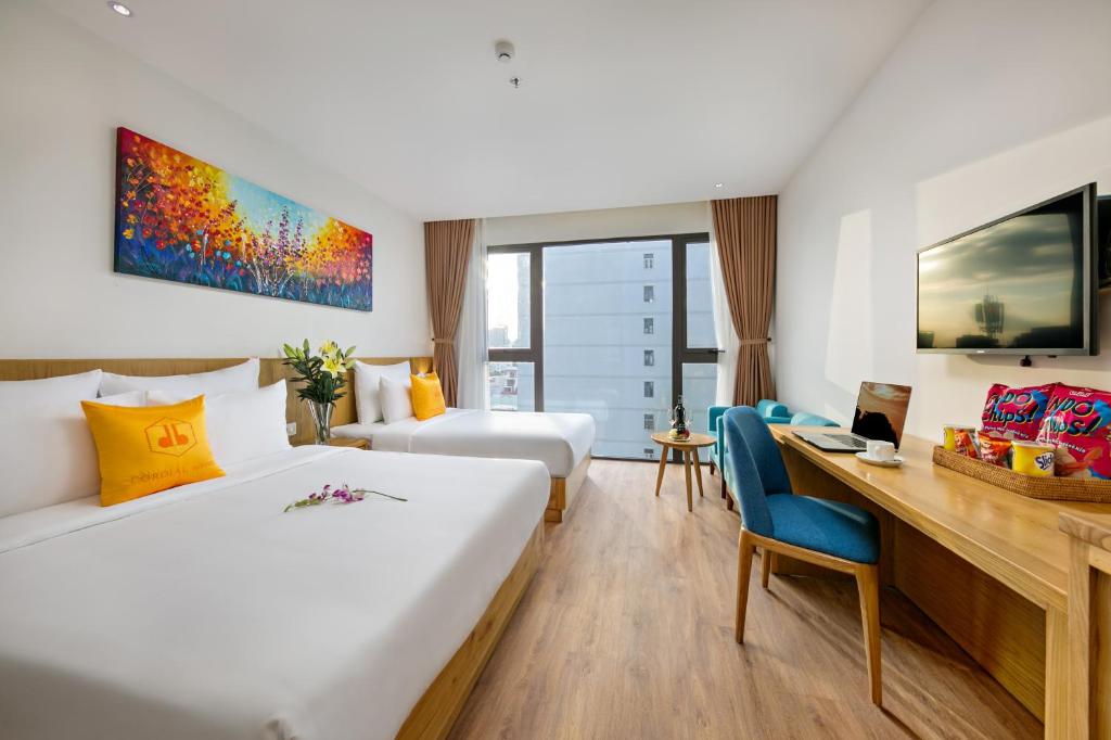 Postel nebo postele na pokoji v ubytování Cordial Beach Hotel Da Nang