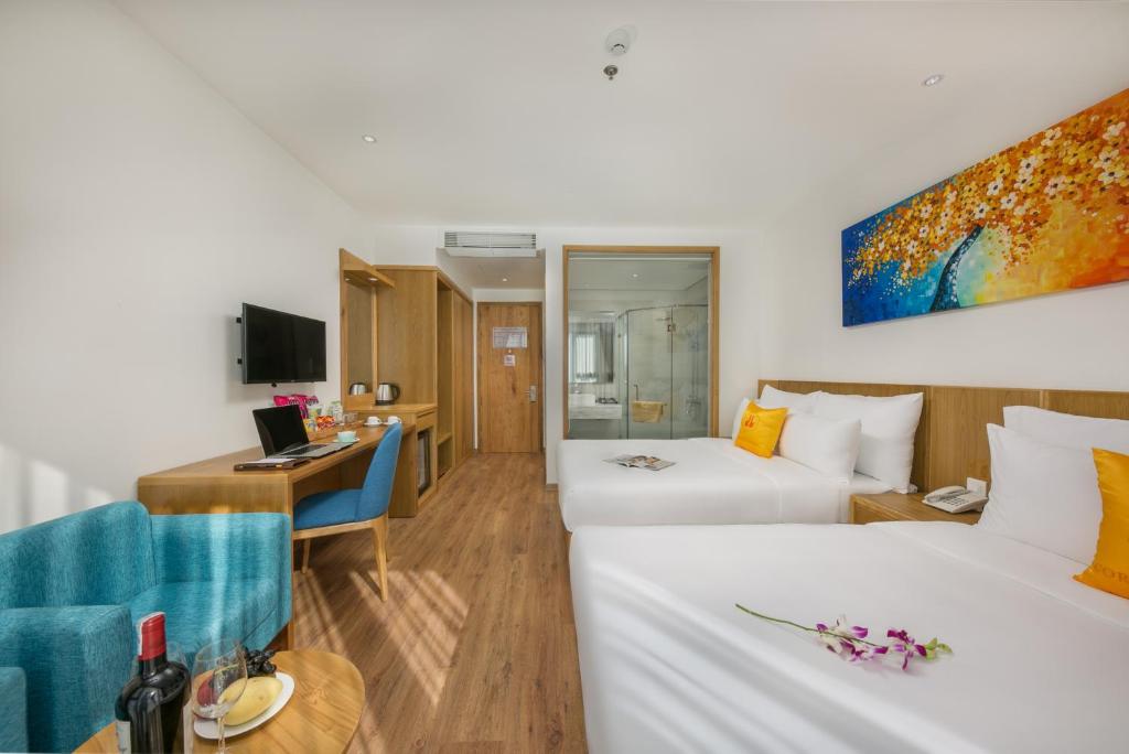 Postel nebo postele na pokoji v ubytování Cordial Beach Hotel Da Nang