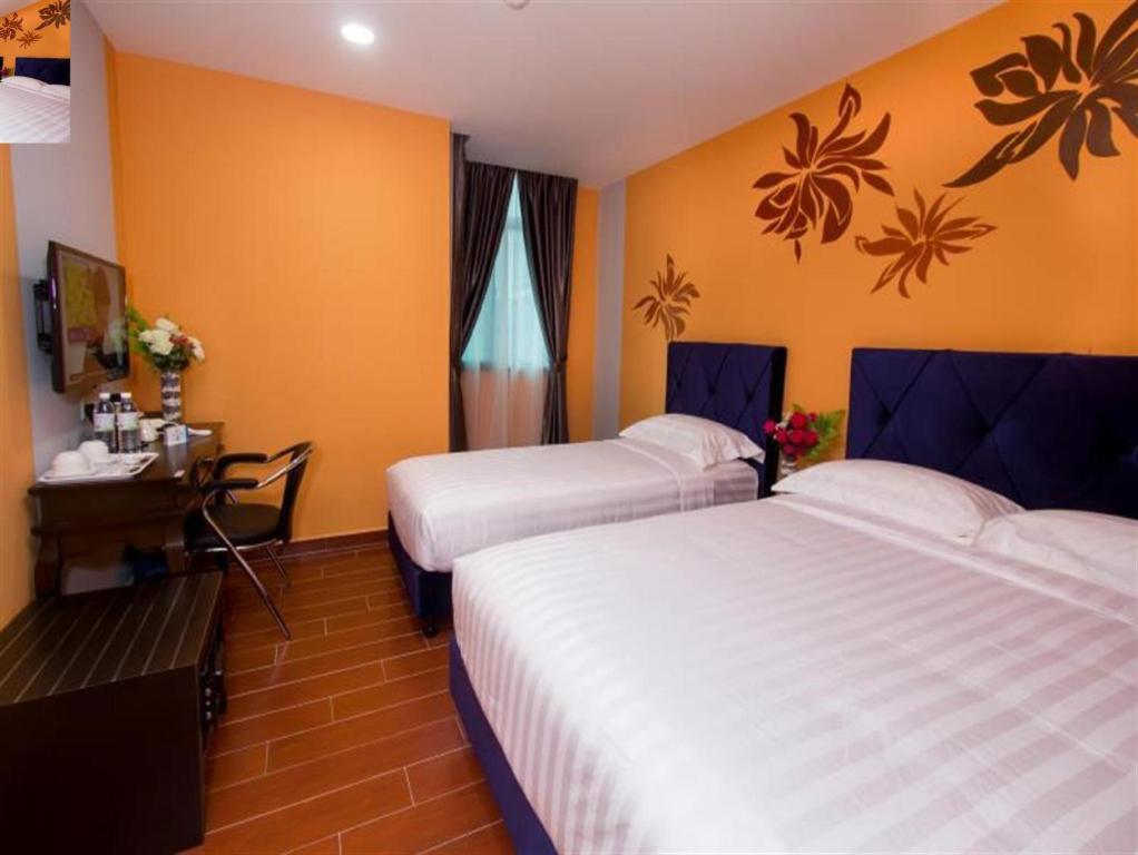 Postel nebo postele na pokoji v ubytování Elmark Hotel Johor