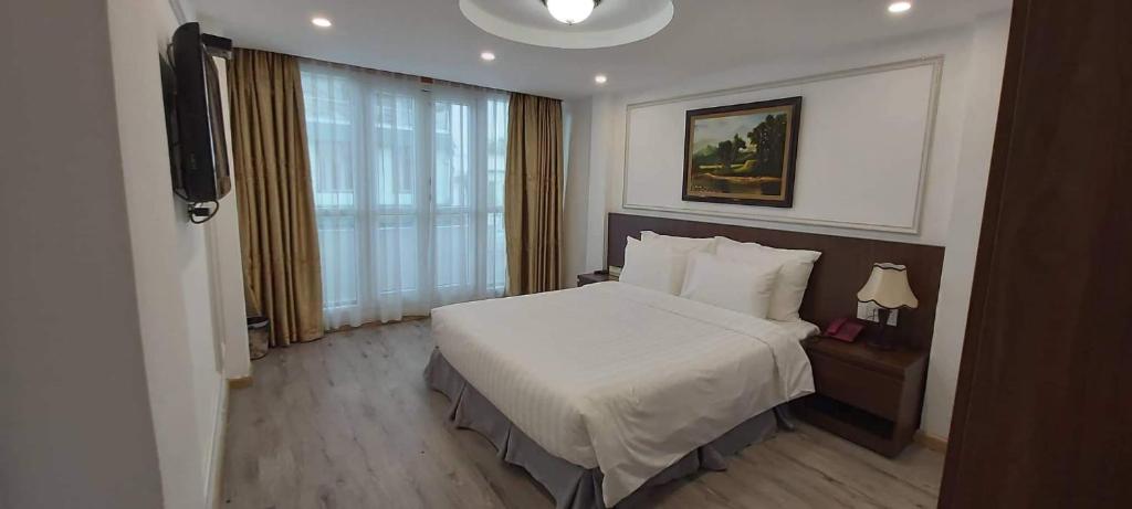 Postel nebo postele na pokoji v ubytování Hanoi Endless Hotel