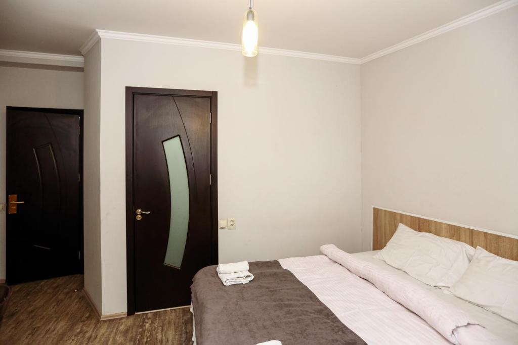 Postel nebo postele na pokoji v ubytování Hotel Rustaveli 36