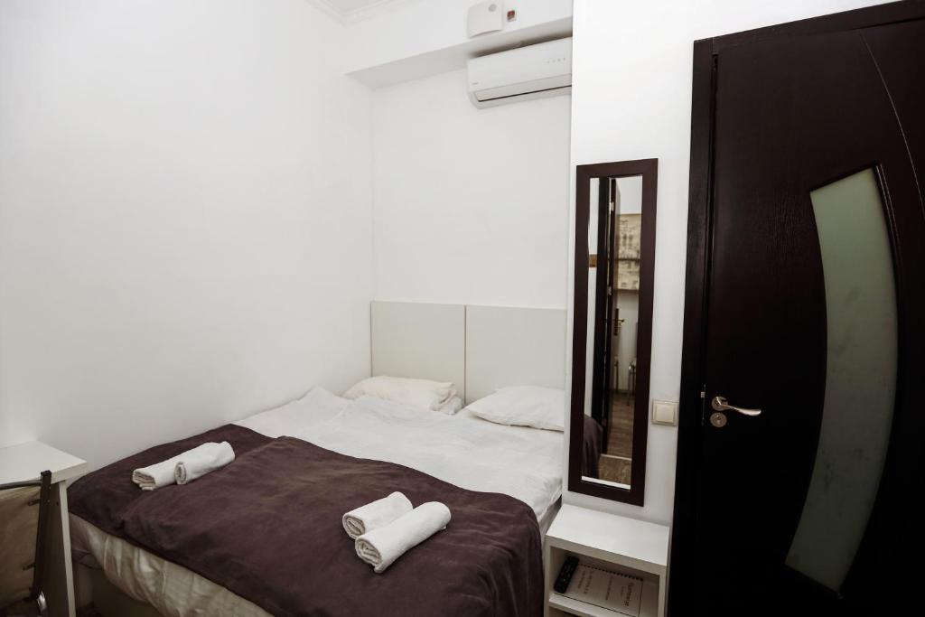 Postel nebo postele na pokoji v ubytování Hotel Rustaveli 36