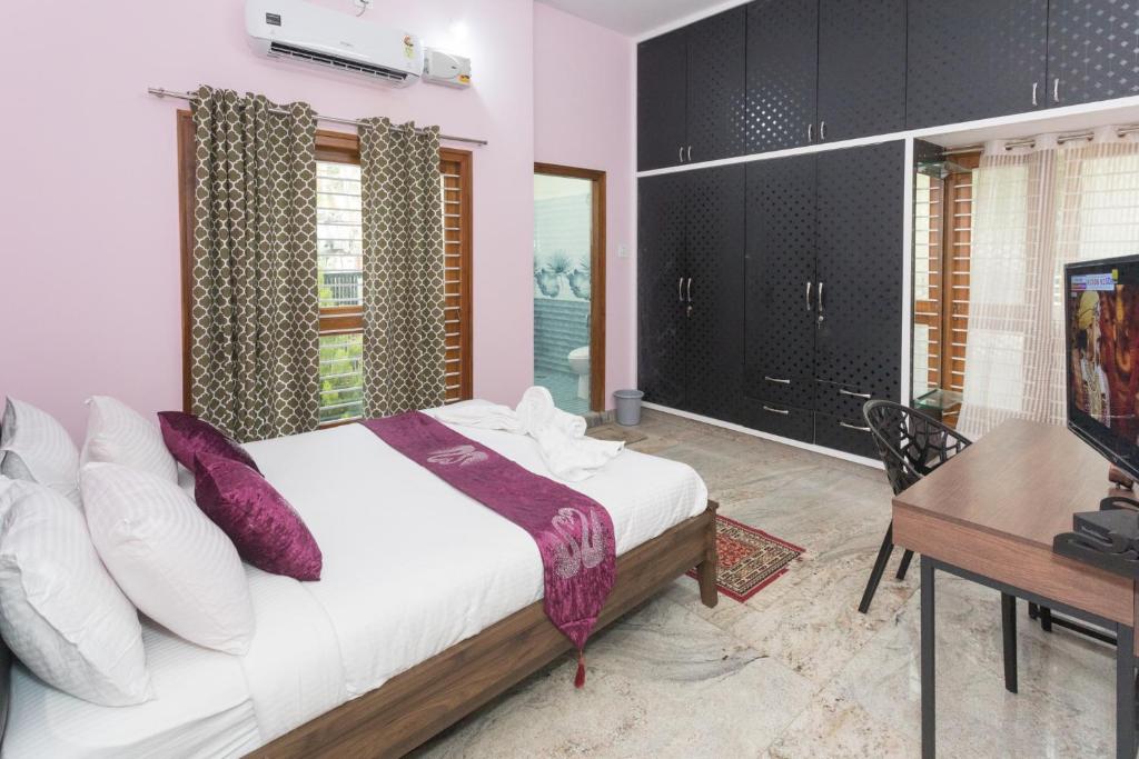 Postel nebo postele na pokoji v ubytování LikeMyHome Homestay Mysore