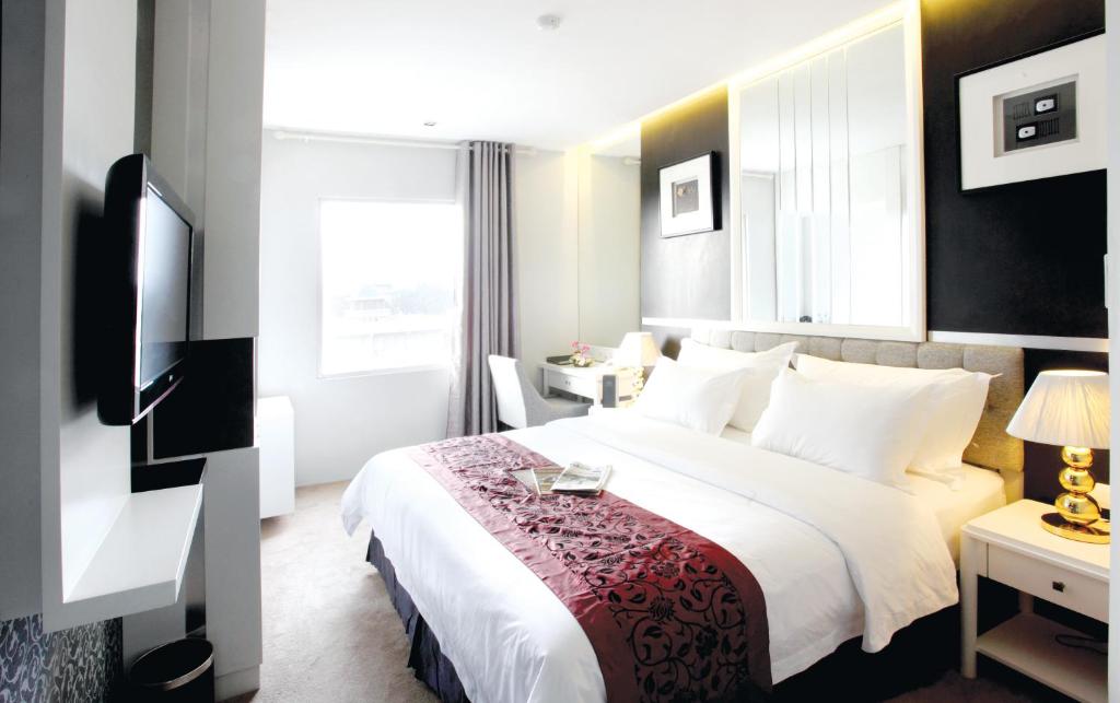 Postel nebo postele na pokoji v ubytování Gino Feruci Braga by KAGUM Hotels