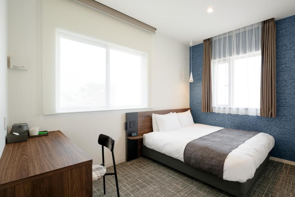 Postel nebo postele na pokoji v ubytování M's Hotel Kyoto Station Kizuya