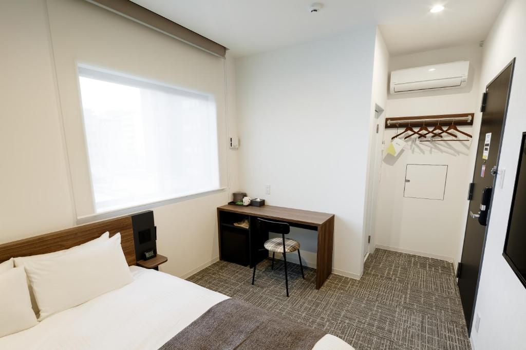 Postel nebo postele na pokoji v ubytování M's Hotel Kyoto Station Kizuya