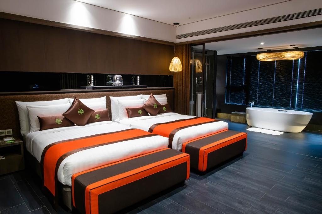 Postel nebo postele na pokoji v ubytování arTree hotel