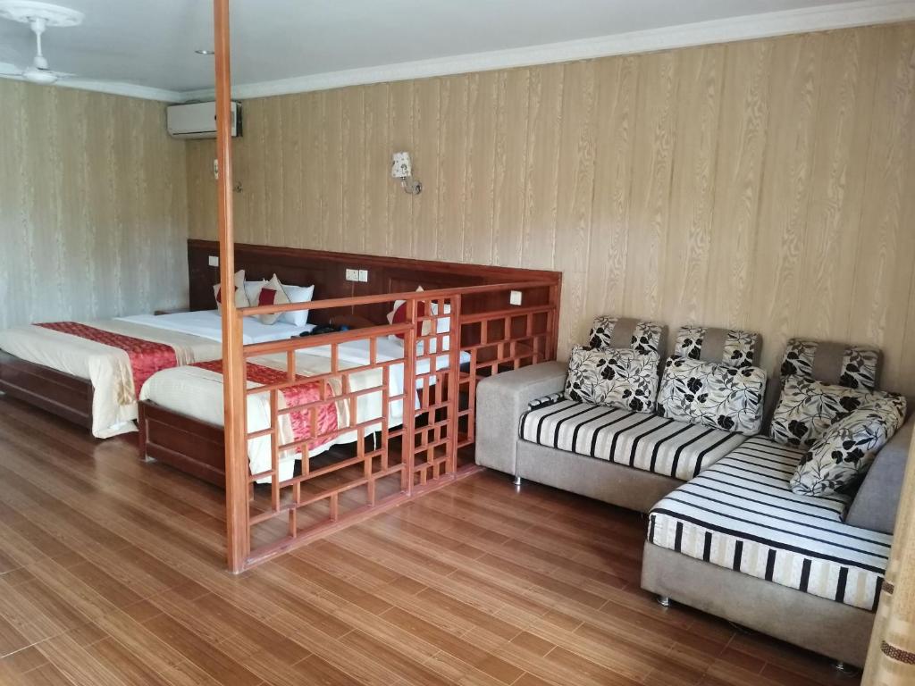 Postel nebo postele na pokoji v ubytování Hotel Wildlife Camp