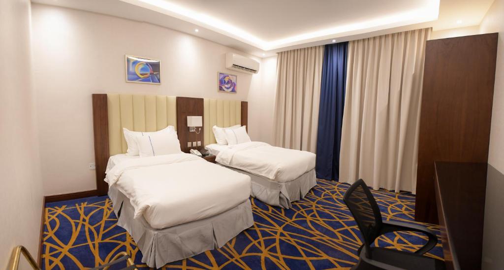 Postel nebo postele na pokoji v ubytování فندق قوبا إن - Quba Inn Hotel