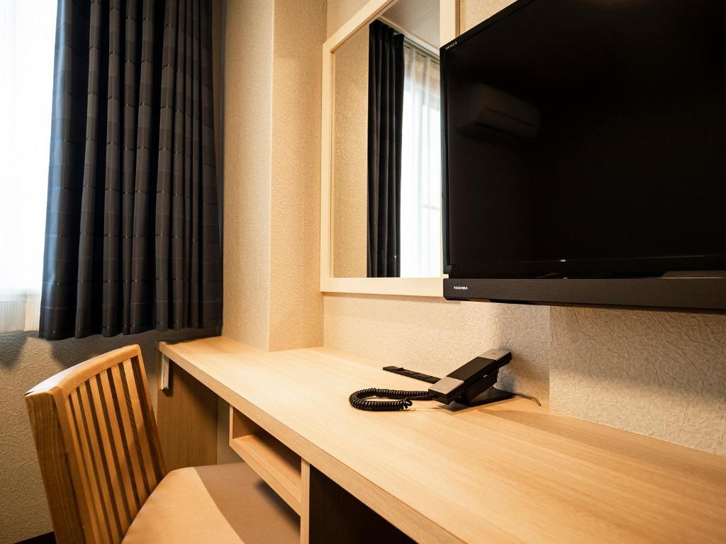 TV a/nebo společenská místnost v ubytování Hotel AreaOne Izumo