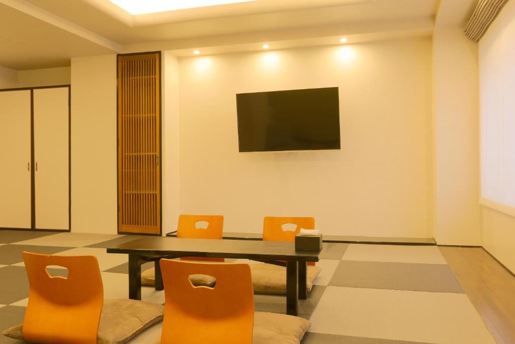 TV a/nebo společenská místnost v ubytování Tabist S hyde Park Koga Station