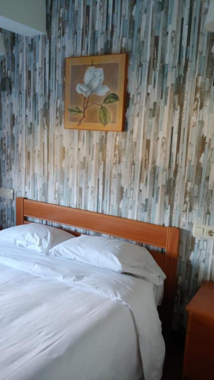 Postel nebo postele na pokoji v ubytování Hotel Camiño do Mar