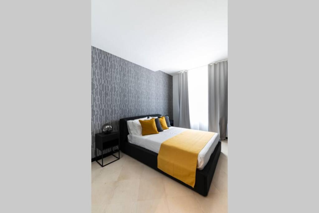 Postelja oz. postelje v sobi nastanitve LAUS app.2 - ART & DESIGN nel cuore di Bari - Via Dante Alighieri