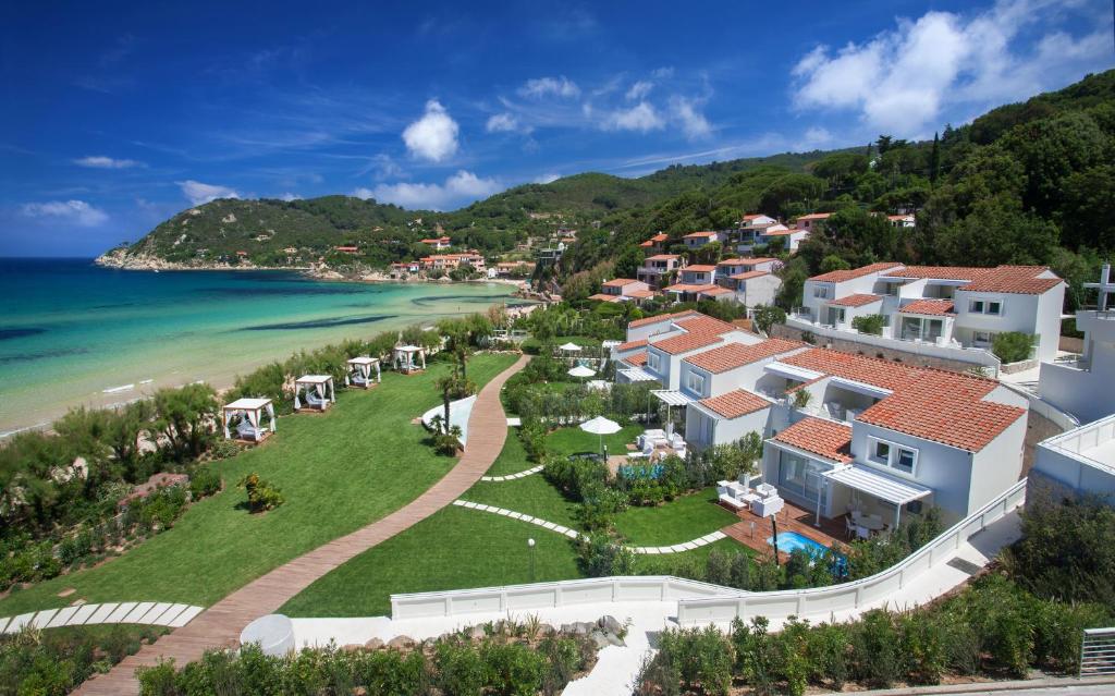 an aerial view of a resort and the beach at Baia Bianca Suites in Portoferraio