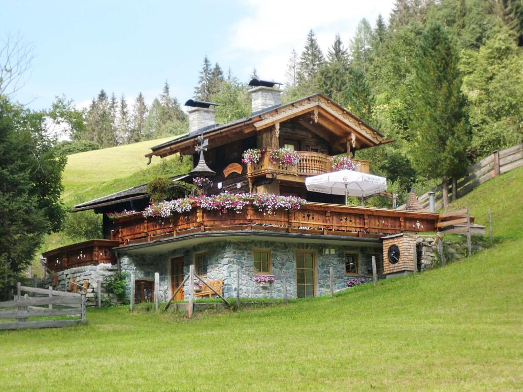 a large house with a balcony on a hill at Almliesl RAUR-521 in Rauris