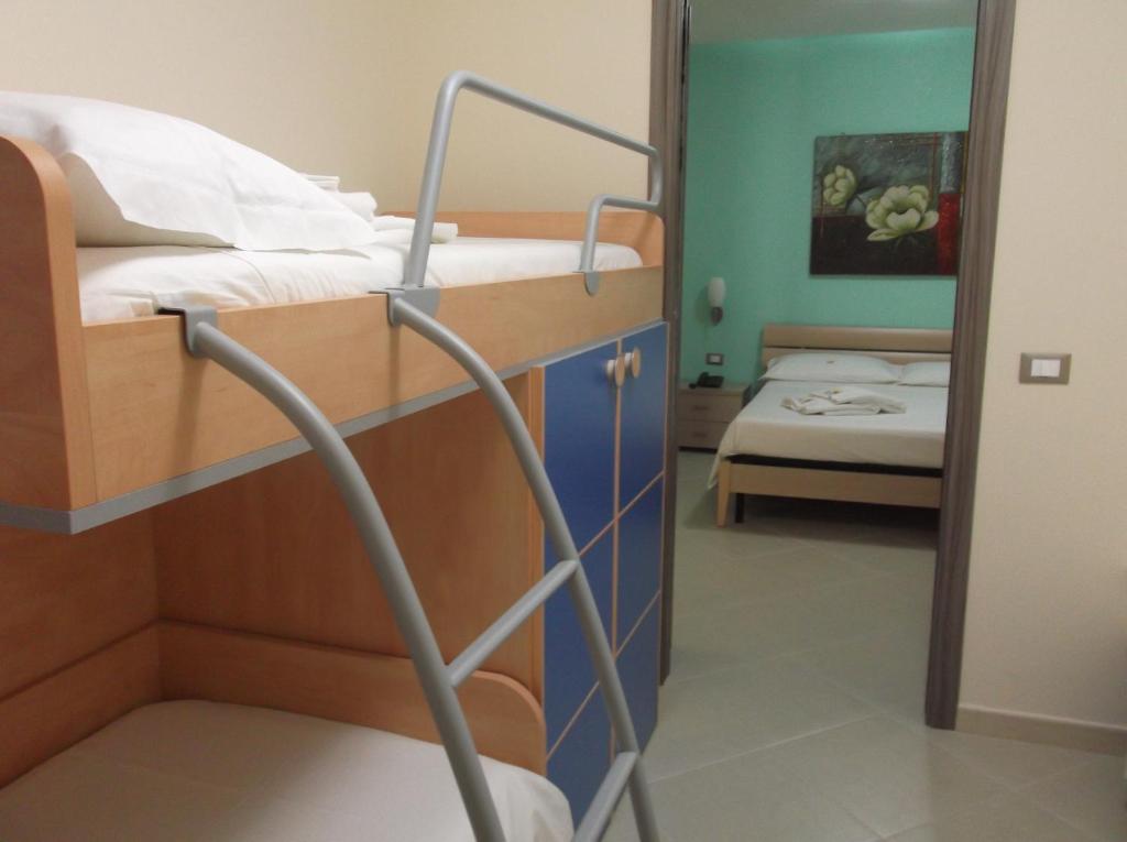 Łóżko lub łóżka w pokoju w obiekcie Suliccenti b&b Marzamemi