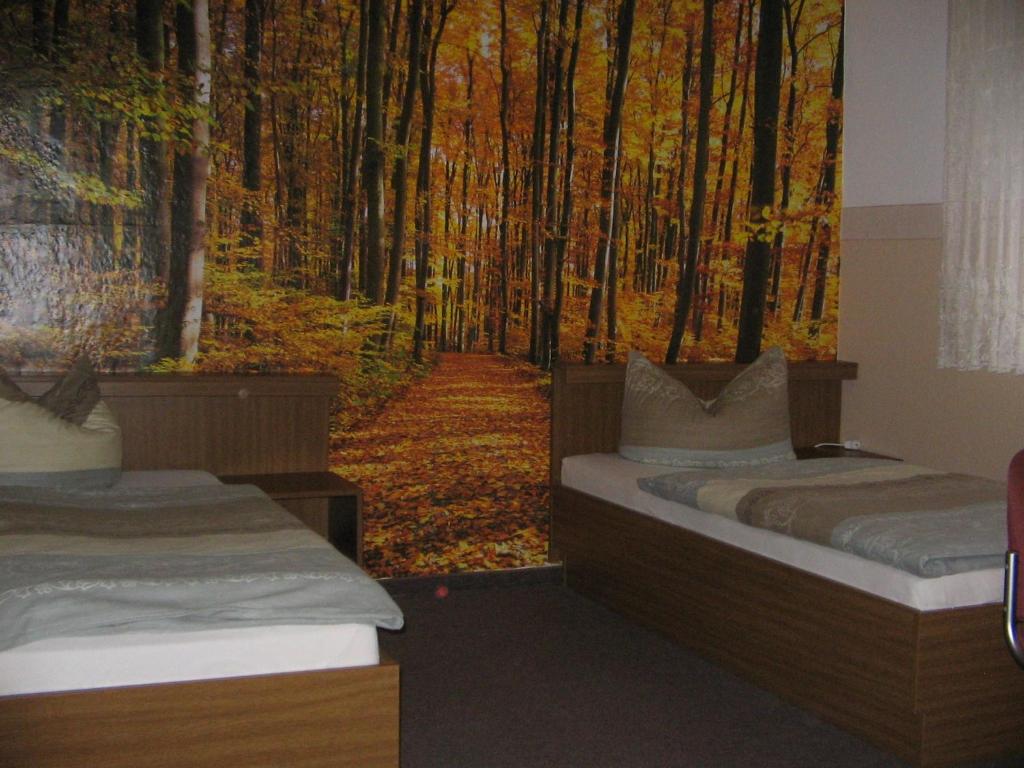 Postel nebo postele na pokoji v ubytování Pension "City"