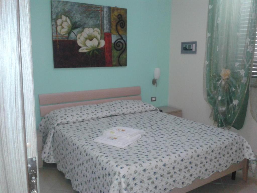 Łóżko lub łóżka w pokoju w obiekcie Suliccenti b&b Marzamemi