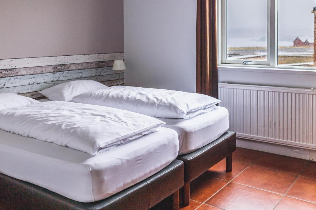 Postel nebo postele na pokoji v ubytování Álfheimar Hotel