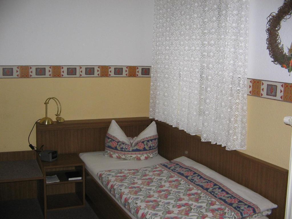 Postel nebo postele na pokoji v ubytování Pension "City"