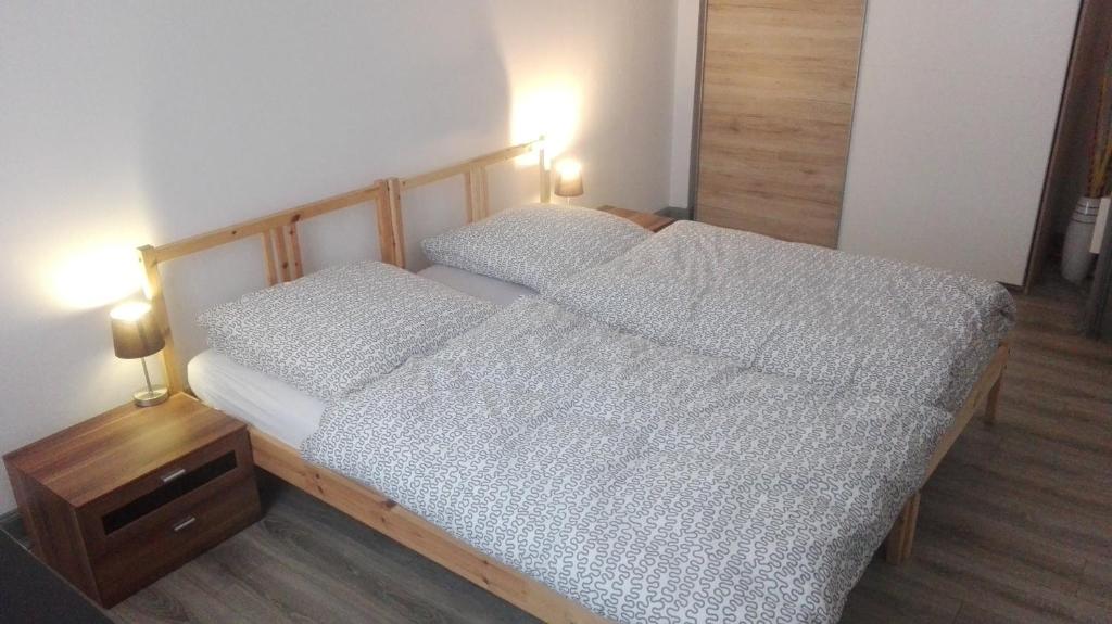 a bedroom with two twin beds and a night stand at Apartment in Bad Ems in Bad Ems