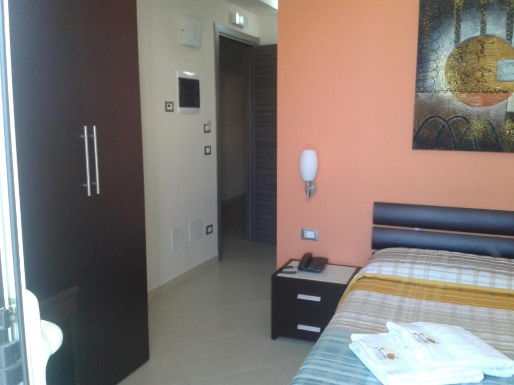 Łóżko lub łóżka w pokoju w obiekcie Suliccenti b&b Marzamemi