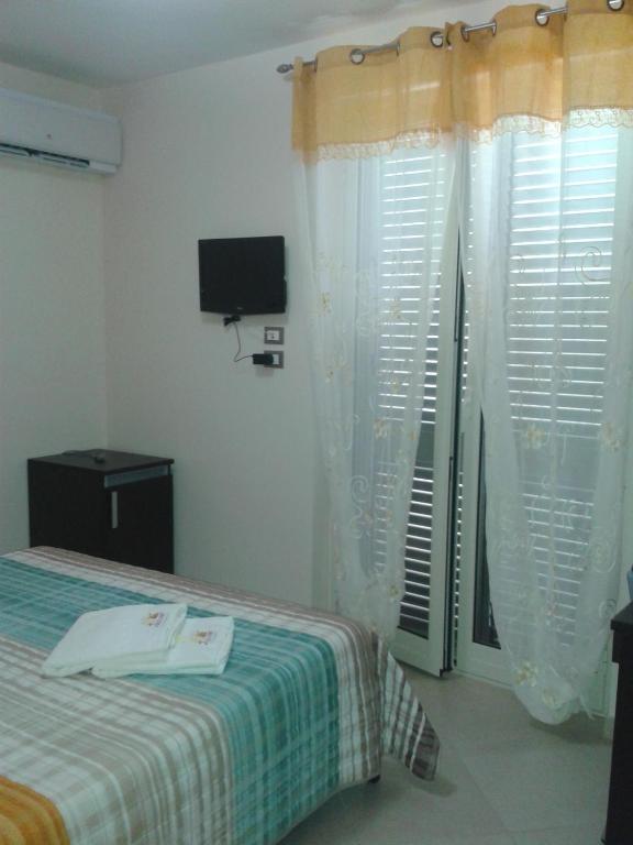 Łóżko lub łóżka w pokoju w obiekcie Suliccenti b&b Marzamemi