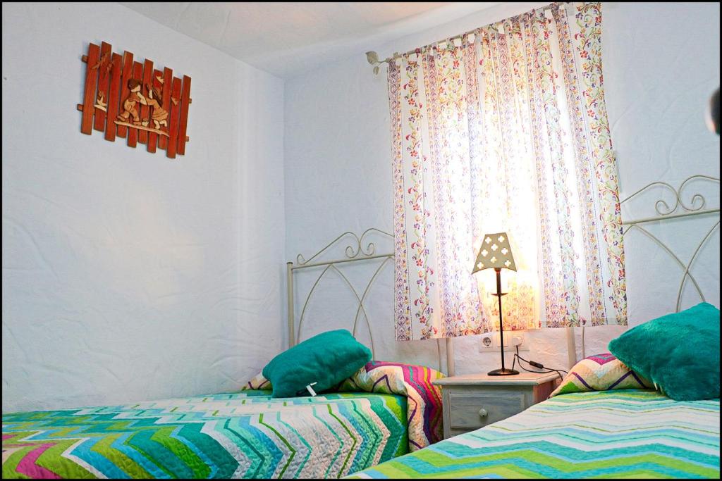 Postel nebo postele na pokoji v ubytování Casa Roche Viejo