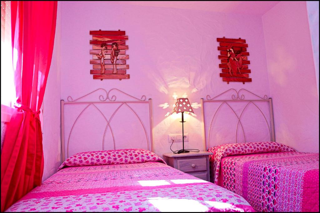 Postel nebo postele na pokoji v ubytování Casa Roche Viejo