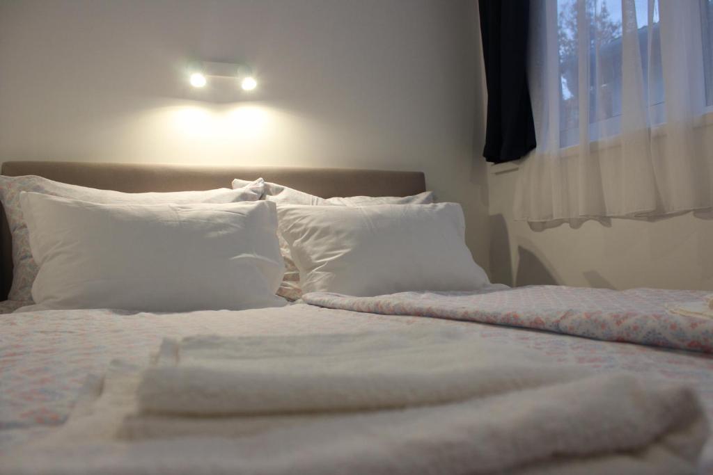 Postel nebo postele na pokoji v ubytování PLAGE-ON Panzió