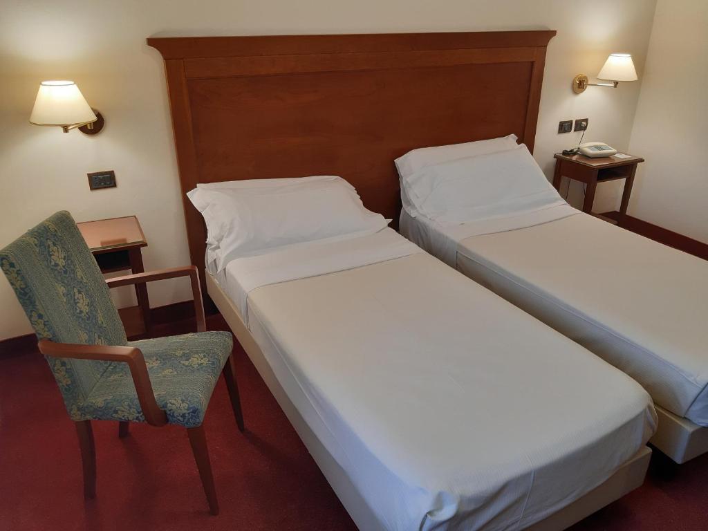Postel nebo postele na pokoji v ubytování Hotel HR