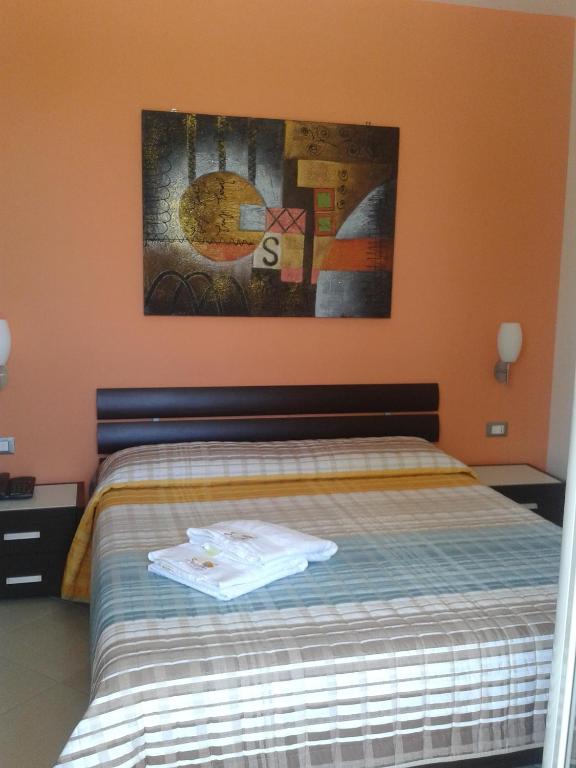 Łóżko lub łóżka w pokoju w obiekcie Suliccenti b&b Marzamemi