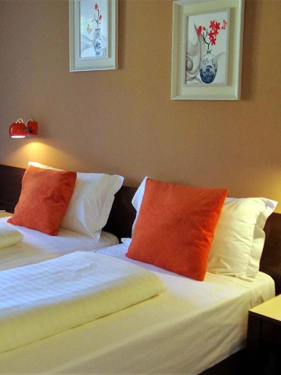 Postel nebo postele na pokoji v ubytování Hotel Bologna