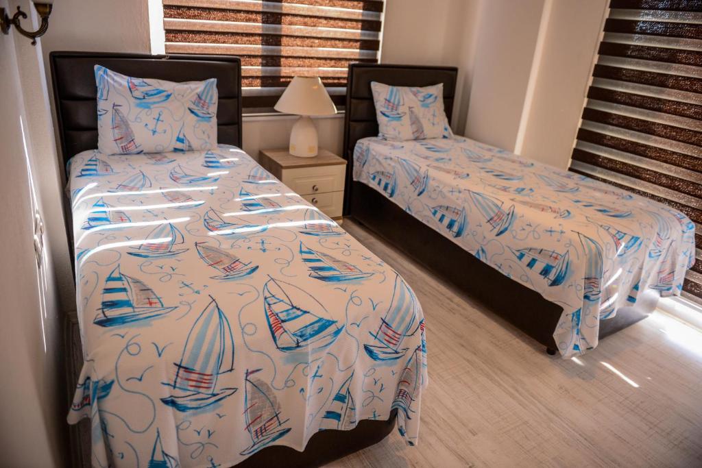 Postel nebo postele na pokoji v ubytování Villa Calıs 2