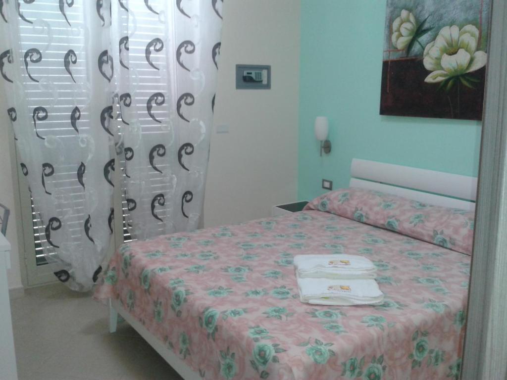 Łóżko lub łóżka w pokoju w obiekcie Suliccenti b&b Marzamemi