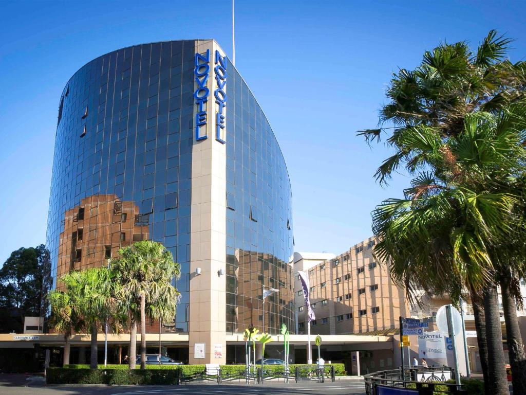 a large building with a large clock on it at Novotel Sydney Parramatta in Sydney