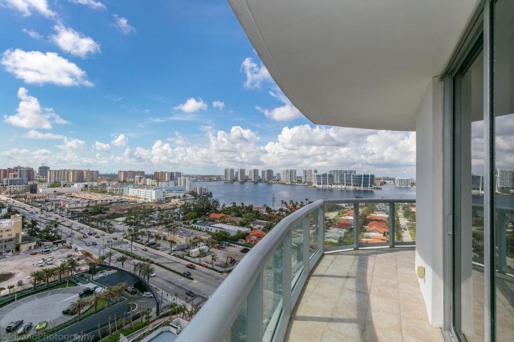 a view of a city from a balcony of a building at Ocean View 25th floor at Marenas Beach Resort by AmmosFL in Miami Beach