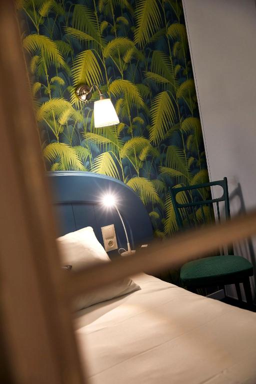 Postel nebo postele na pokoji v ubytování La Flambée