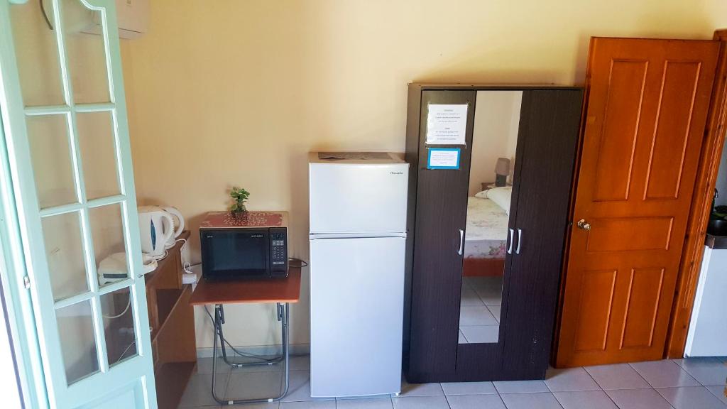 Kuchyň nebo kuchyňský kout v ubytování Galaxy Rooms