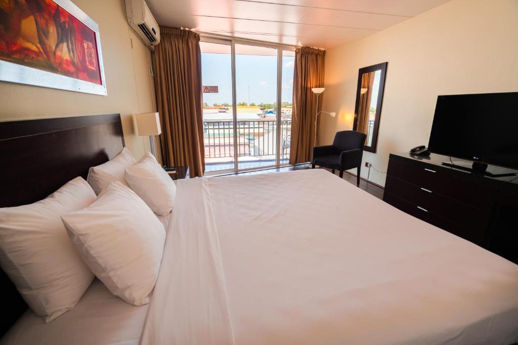 Postel nebo postele na pokoji v ubytování Radisson Hotel Paramaribo