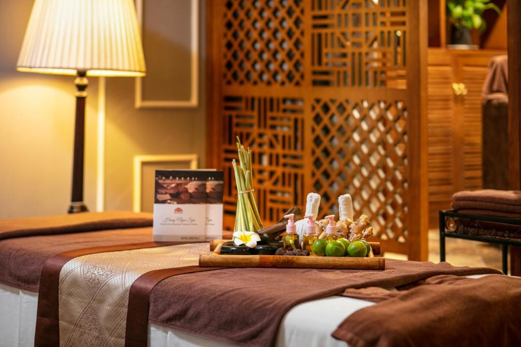 Postel nebo postele na pokoji v ubytování Hong Ngoc Dynastie Boutique Hotel & Spa