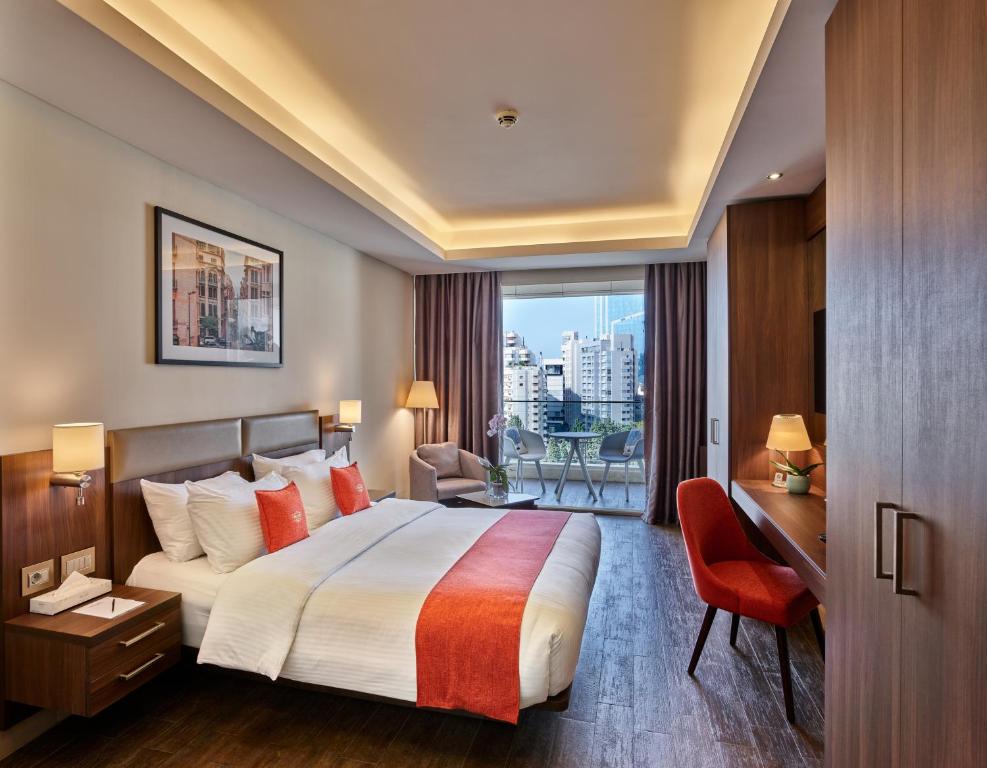 Postel nebo postele na pokoji v ubytování Sodeco Suites
