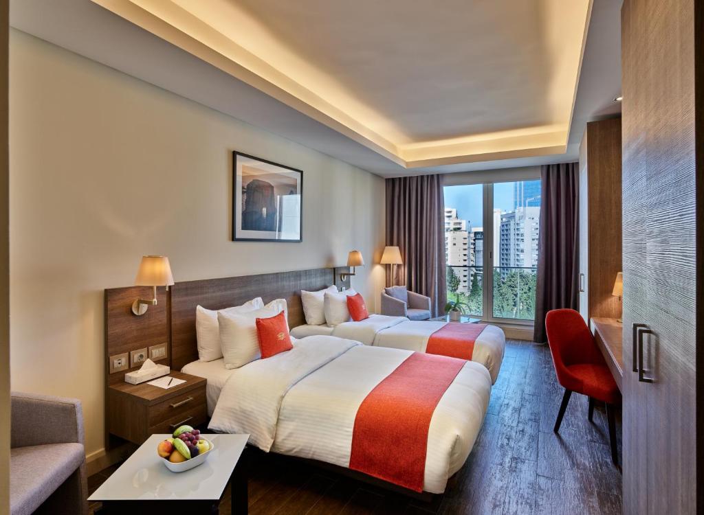 Postel nebo postele na pokoji v ubytování Sodeco Suites