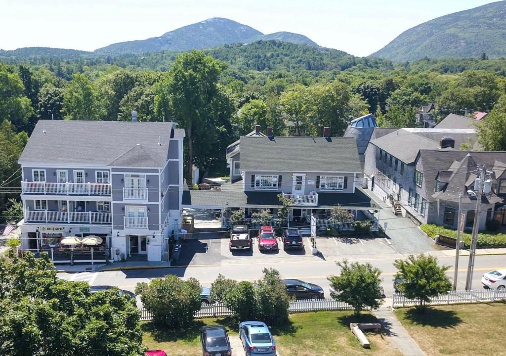 an aerial view of a house with mountains in the background at Acadia Hotel - Downtown in Bar Harbor