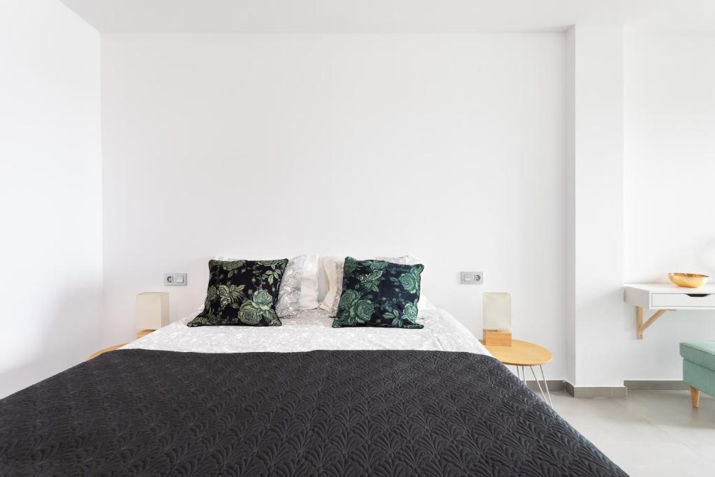 Posteľ alebo postele v izbe v ubytovaní Apartamentos Las Terrazas de Sotavento