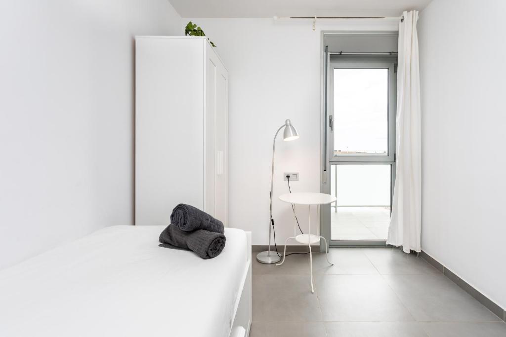Posteľ alebo postele v izbe v ubytovaní Apartamentos Las Terrazas de Sotavento