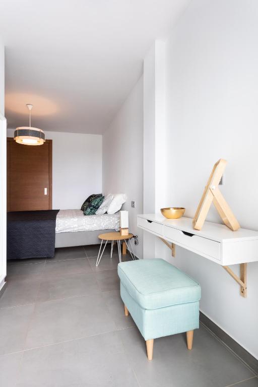 Posteľ alebo postele v izbe v ubytovaní Apartamentos Las Terrazas de Sotavento