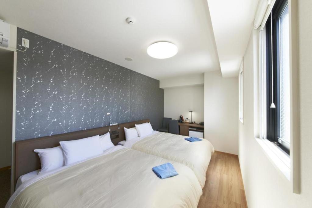 Postelja oz. postelje v sobi nastanitve Hotel Sun Clover Koshigaya Station - Vacation STAY 55385