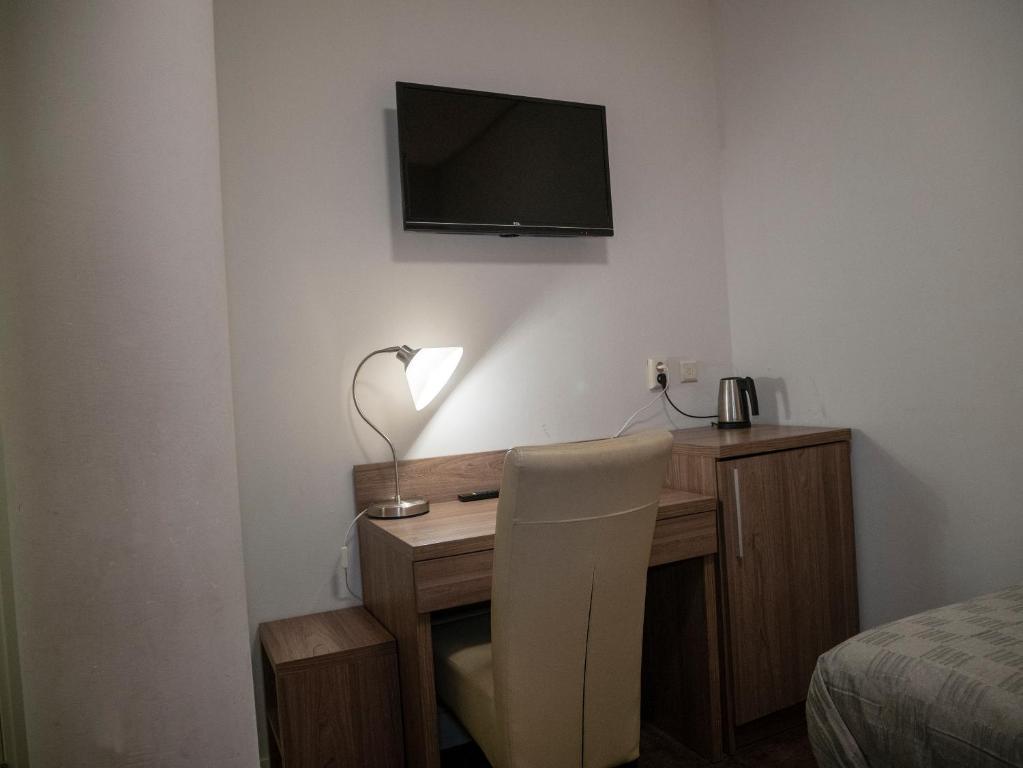 TV a/nebo společenská místnost v ubytování Hotel Hague Center