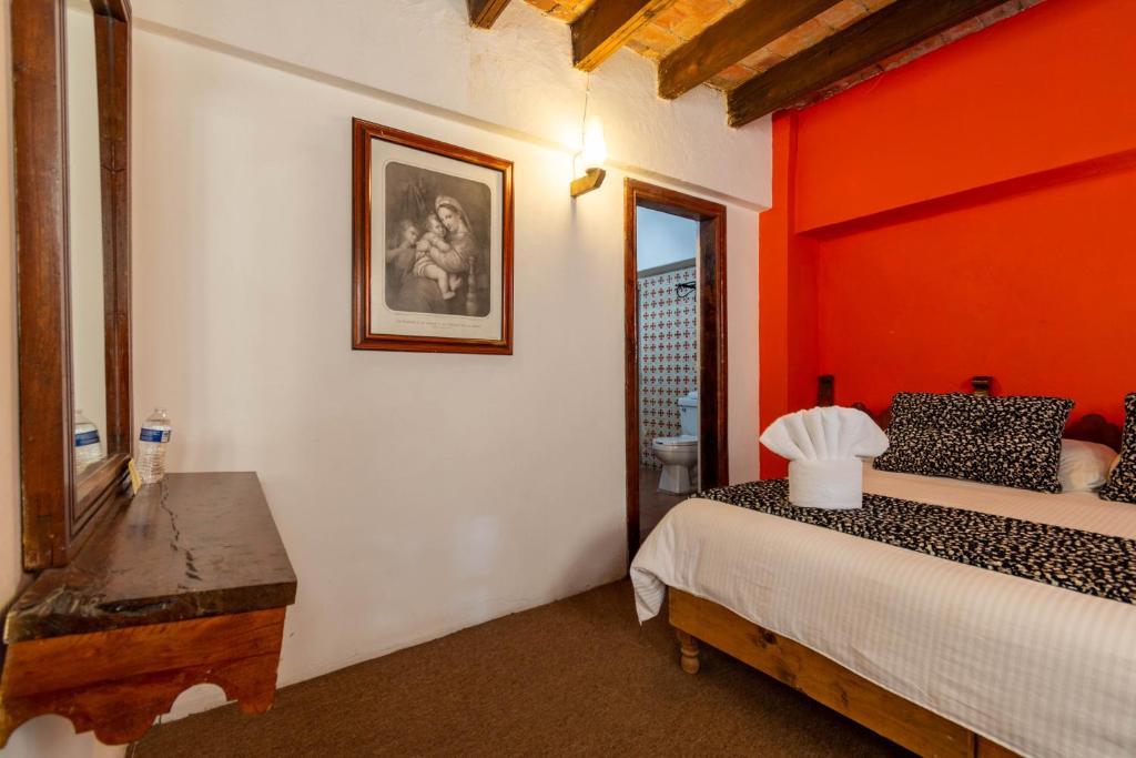Postel nebo postele na pokoji v ubytování Hosteria del Frayle